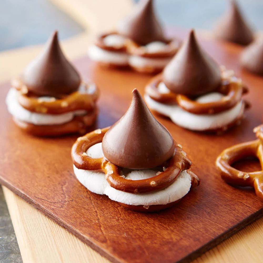 tray of freshly made hersheys kisses candy pretzel smores