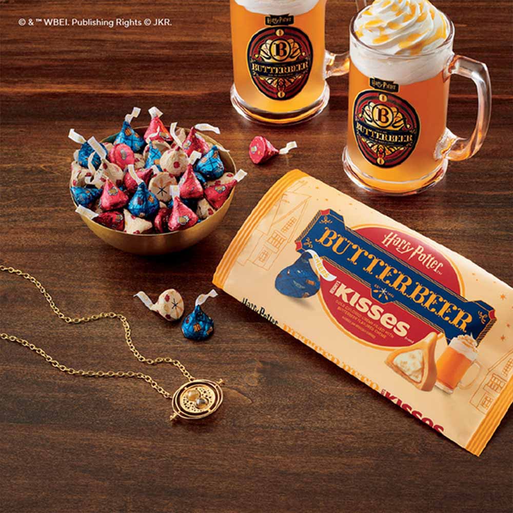 bag of hersheys kisses harry potter butterbeer flavor candies beside mugs of butterbeer