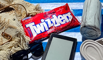 bag of twizzlers on beach towel